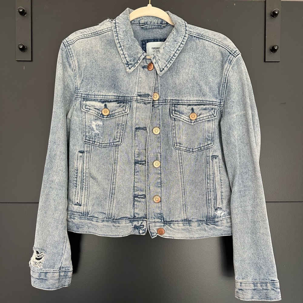 Distressed denim jacket with rose gold buttons